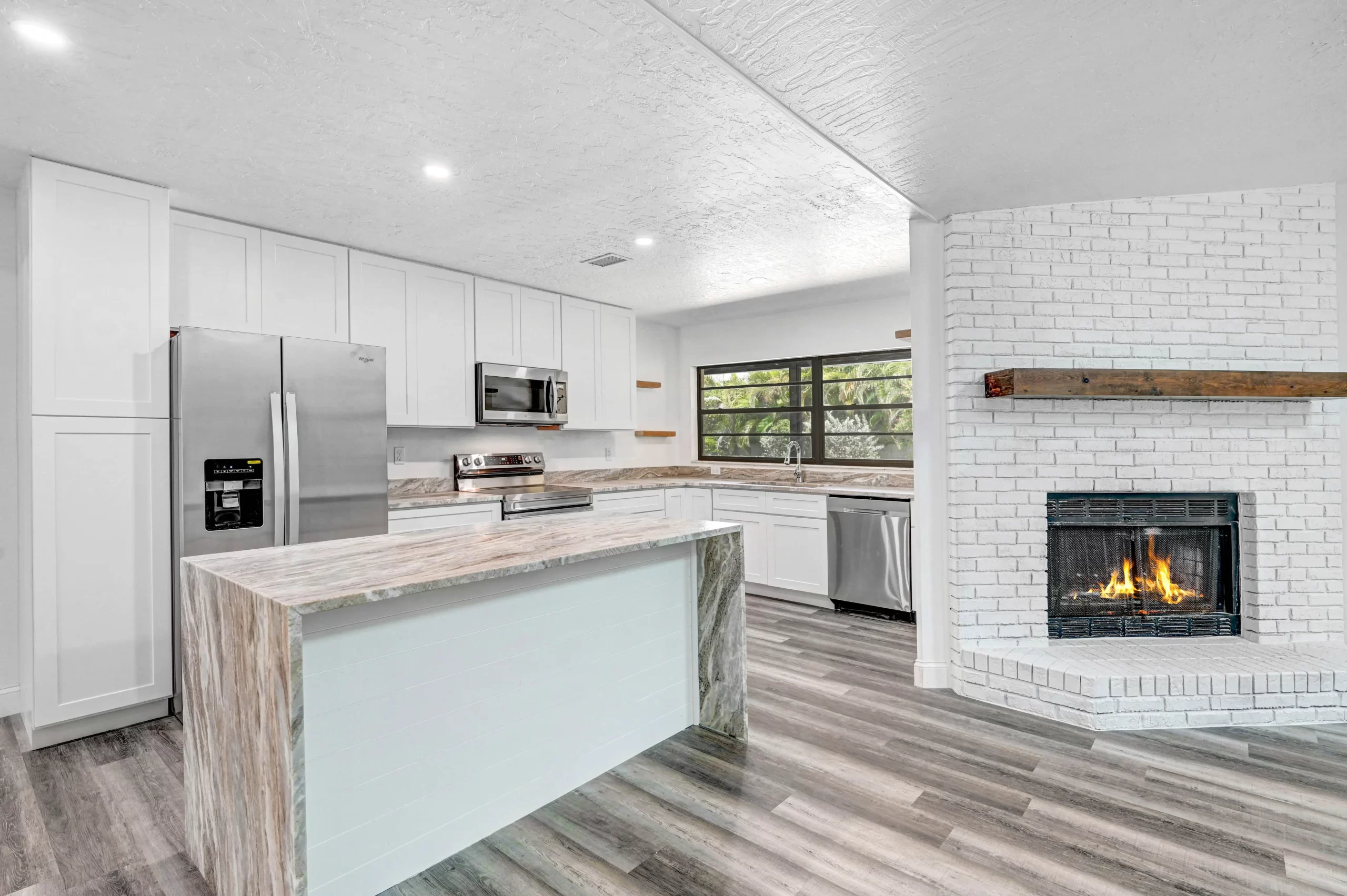 4 Judy Court Kitchen After — Island and Fireplace